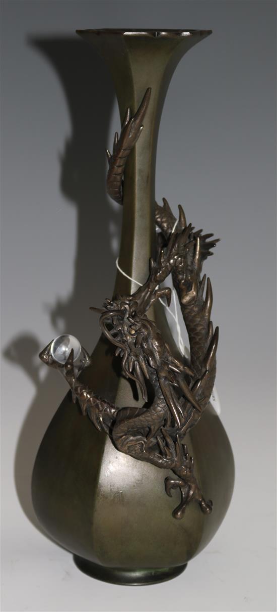 A Japanese bronze dragon hexagonal bottle vase, c.1880, 35.5cm